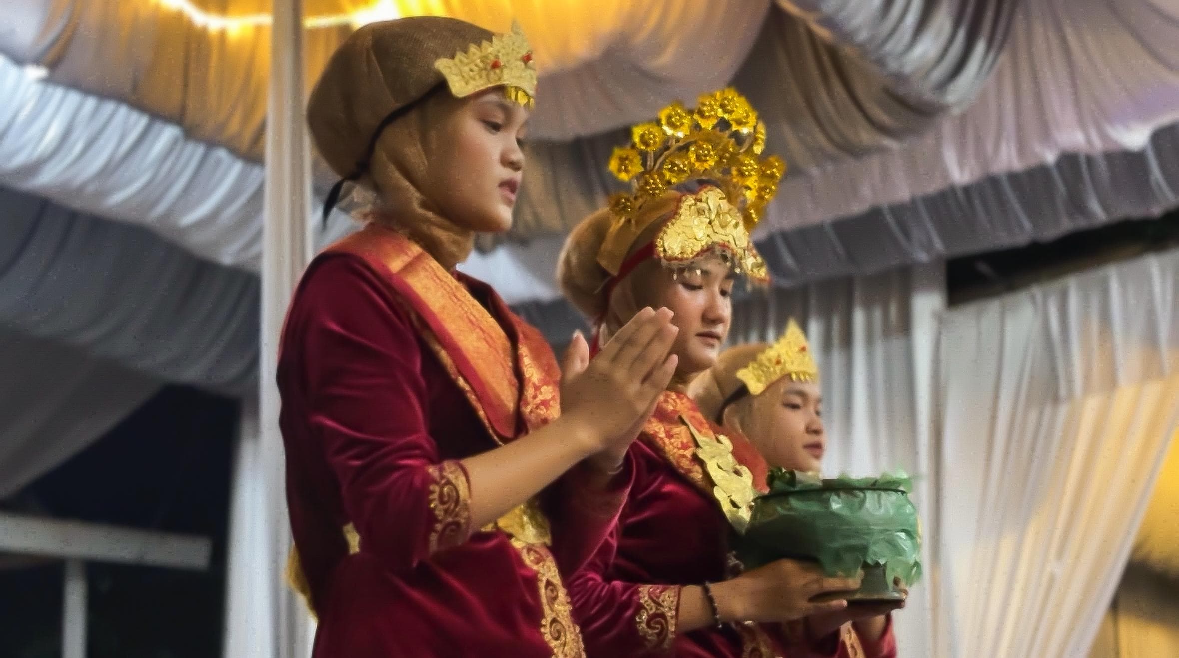 Desa Wogo - Traditional ceremony with people in traditional red clothing and Indonesian flag